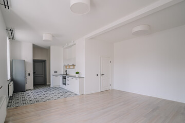 Classical empty room interior. The rooms have wooden floors and gray walls ,decorate with white moulding,there are white window looking out to the nature view.