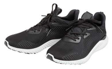 Pair of new unbranded black sport running shoes, sneakers or trainers isolated on transparent background