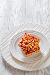 Raspberry Crumble Bars on white plate, top view