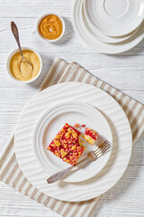 Raspberry Crumble Bars on white plate, top view