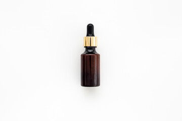 Face serum essential oil in dropper bottle top view