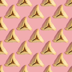 Seamless pattern with traditional Purim cookie Hamantaschen on pink background.