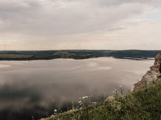 The banks of a large river. A calm smooth water view. The landscape of Bakota Bay on the Dniester river, Ukraine.