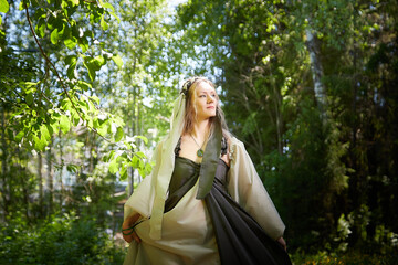 Beautiful seductive dryad. Pagan spirit of the forest. Portrait of beautiful dryad. Fairy who loves...