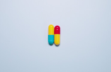 Pharmaceutical medicine pills, tablets and capsules on blue background. Top view. Flat lay. Copy...