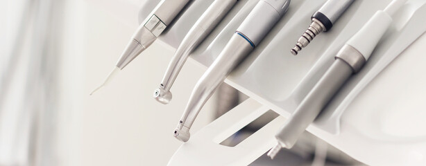 Closeup banner of a modern dentist tools, burnishers with blurred background. High quality horizontal photo from dentist room.