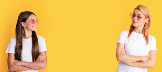 Mother and daughter child banner, copy space, isolated background. beauty and fashion. female fashion model. young girls in eyeglasses.