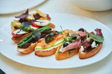 Sandwiches with assorted fillings, meat, fish, vegetables.