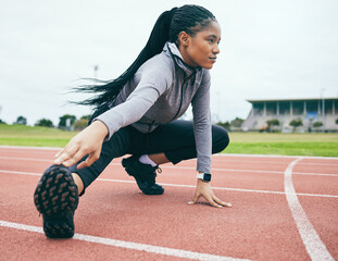 Fitness, exercise and black woman stretching legs for health and wellness at stadium outdoors....