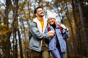 Fototapeta premium Couple spending time together walking in forest.