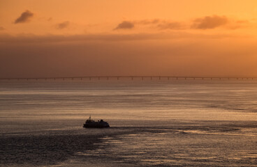 Ship on Tagus river in sunrise light, Lisbon