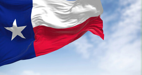 The Texas state flag fluttering in the wind on a sunny day