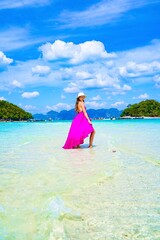 woman in a pink dress on the beach in krabi thailand, chicken island, tup island, poda island, model shooting 