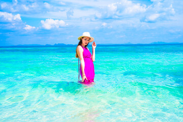 woman in a pink dress on the beach in krabi thailand, chicken island, tup island, poda island, model shooting 