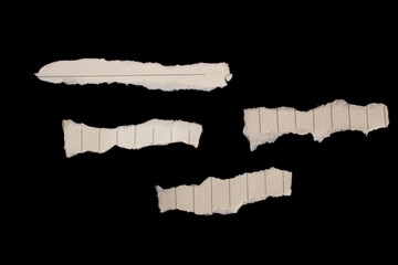 Torn paper piece isolated on black background