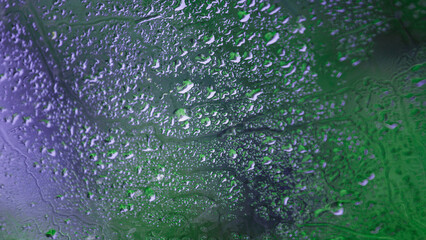 Natural water drops background. Close-up of misted glass with large water drops.