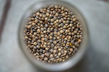 dried fruit, dates, prunes, grains, wheat, lentils, rice stored in glass jars in a kitchen
