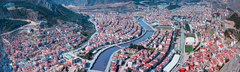 Amasya, Turkey, May 2021: Old Ottoman houses panoramic view by the Yesilirmak River in Amasya City. Amasya is populer tourist destination in Turkey.
