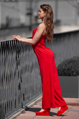 young woman in red dress on the street
