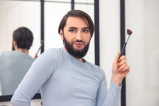 Young man daydreaming during the makeup application - Powered by Adobe