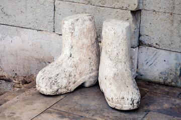 Stone boots, stand at the entrance to the museum. Konya, Turkey
