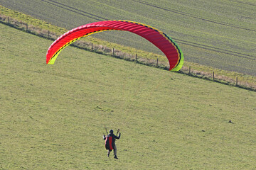 	
Paraglider flying from a hill	