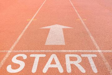 START text and arrow up icon on running track use for start in business,mission,target,goal,education,idea concept.