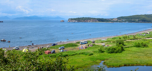 Petropavlovsk-Kamchatsky beach in Zavoyko bay. Camping for fishermen and vacationers by the sea