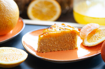 Naklejka na ściany i meble Orange cake or pie. Cozy home baking concept. Still life with delicious pie, tea surrounded by citrus fruits