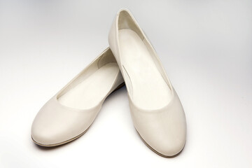 Women's leather shoes without heels, beige color, on white background
