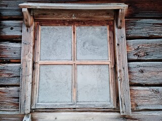 old wooden frosty window in winter