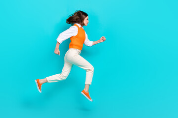 Fototapeta na wymiar Full body photo of successful school girl student running jump hurry get more useful knowledge empty space isolated on aquamarine color background