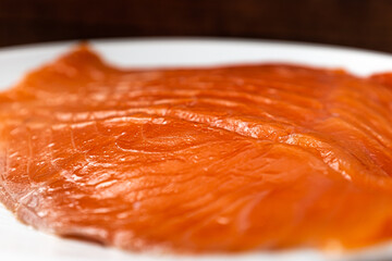 Sliced ​​smoked salmon tender and fragrant