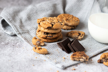 Cookies with pieces of chocolate. On a gray background