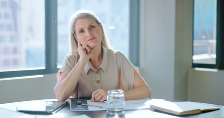 Business, face and senior woman thinking in office, confident and planning for marketing campaign. Mature female, employee and ceo with target, prepare for corporate deal and goal in workplace.