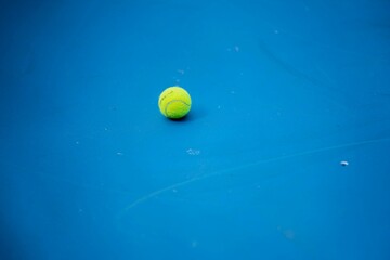Amateur playing tennis at a tournament and match on grass in Melbourne, Australia