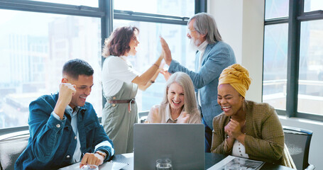 Teamwork, high five and applause of business people on laptop celebrating success, goals or...