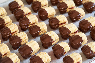 Traditional Christmas cookies filled with marmalade and dipped in chocolate