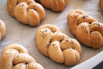 Plaited bread buns made from whole grain spelt flour