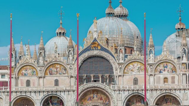 Front view of Basilica of St Mark timelapse. It is cathedral church of Roman Catholic Archdiocese of Venice. It lies at Piazza San Marco. Tourists walking in front of it. Venice, Italy