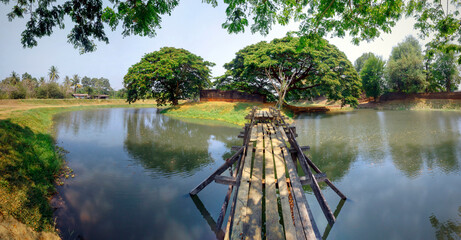 Fortress-Wat Chang Gate on an island in a water channel. Kamphaeng Phet, Thailand