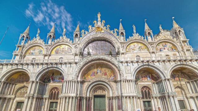 Basilica of St Mark timelapse hyperlapse. Front view of cathedral church of Roman Catholic Archdiocese of Venice. It lies at Piazza San Marco. Tourists walking in front of it. Venice, Italy