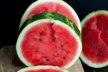 Ripe red watermelon with black seeds