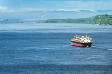 Container ship on St Lawrence river in Quebec, Canada