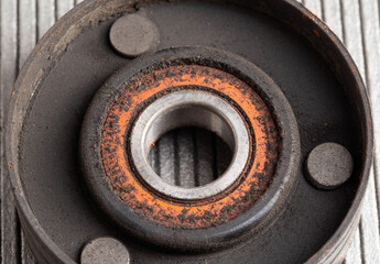 Old bypass car roller. Roller jamming, close-up