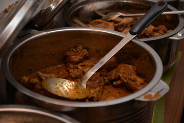 Cooked beef in a cooking pot.
