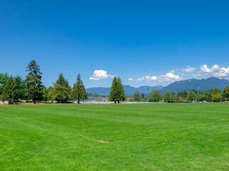 Fototapeta na wymiar Football grass field on bright sunny day in Vancouver