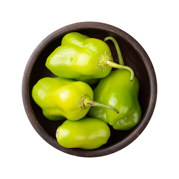 Green cambuci pepper, brazilian cuisine ingredient, on a bowl isolated over transparent background