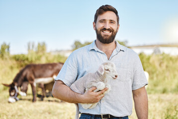 Farmer, portrait or baby lamb on livestock agriculture, countryside environment or nature in sheep...