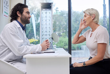 Eye doctor, senior or woman consulting for eyesight advice at optometrist or ophthalmologist with...